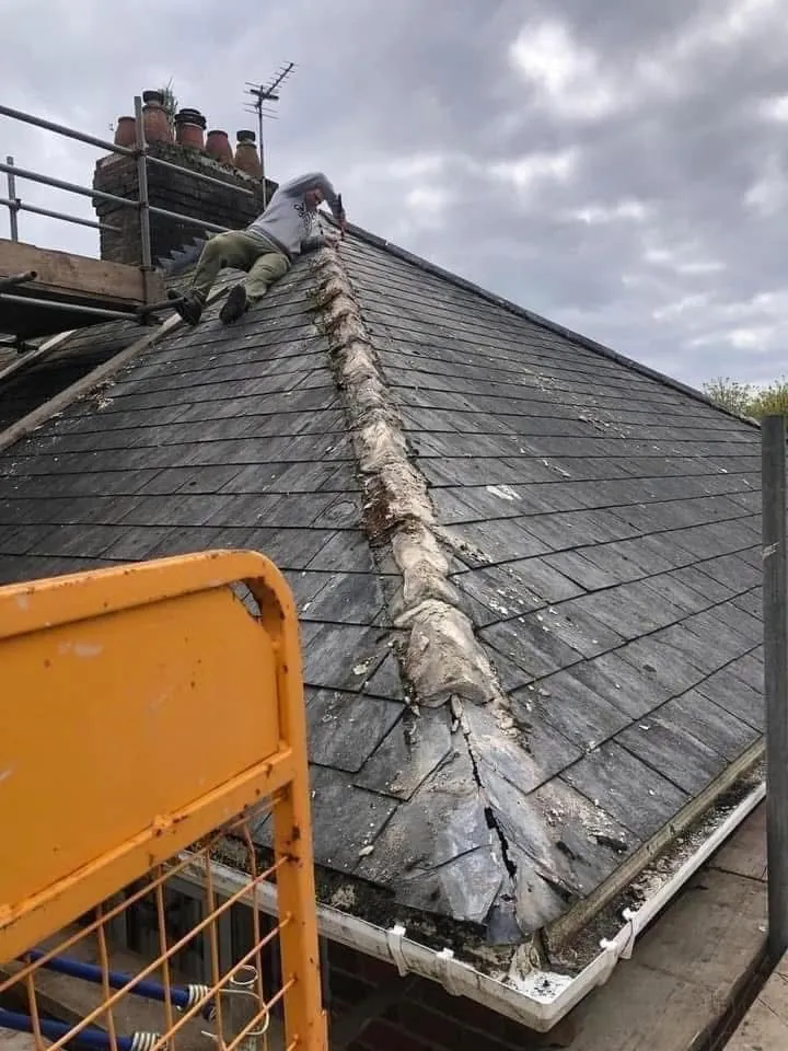 Slate roof ridge and chimney repair in Callington